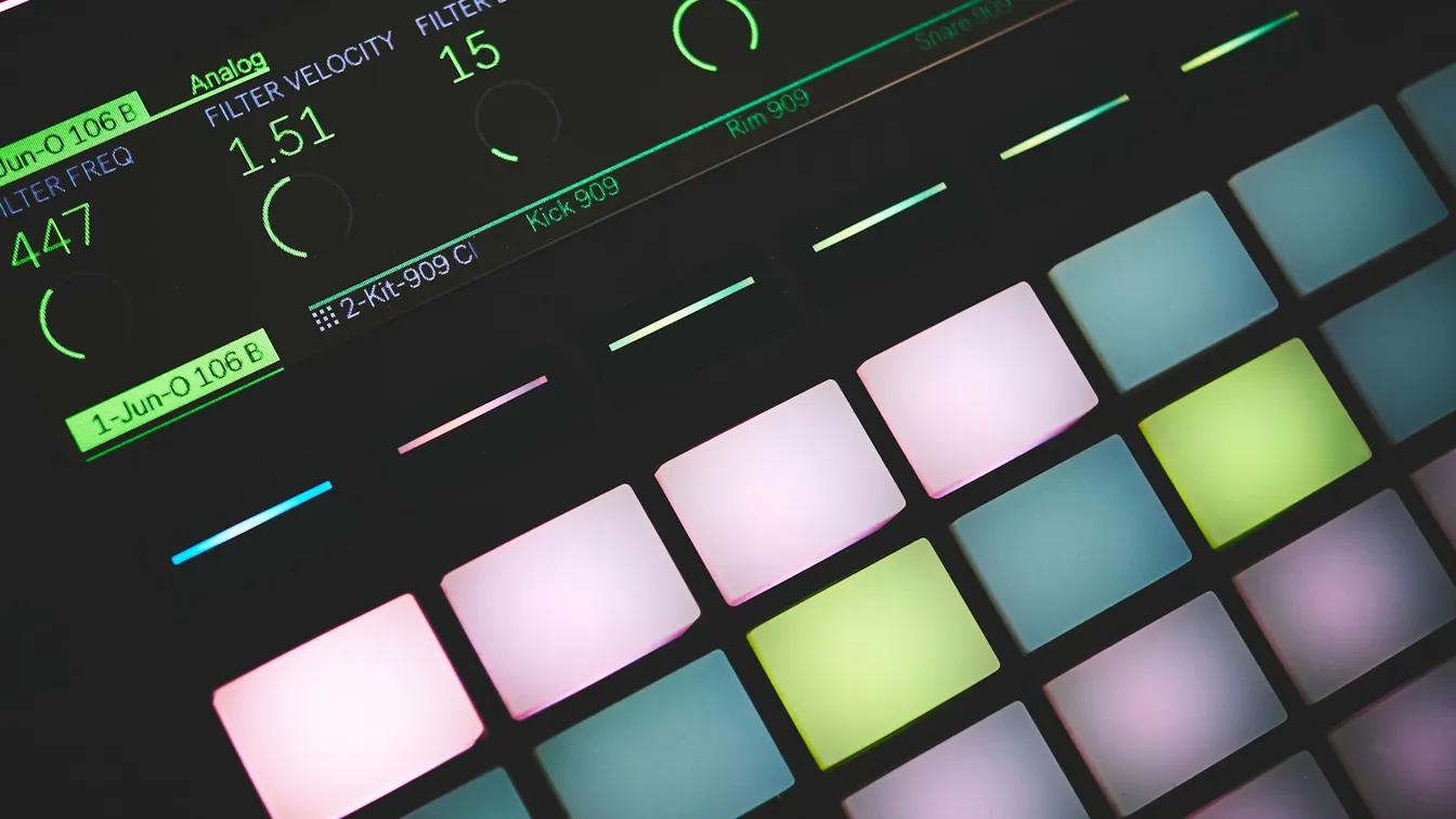 a close up of a dj controller with colorful lights